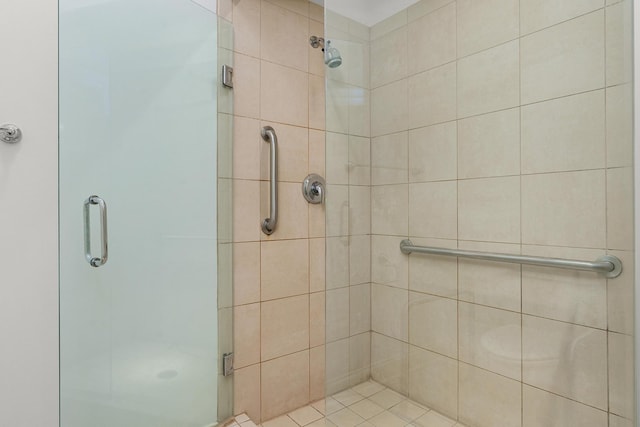 full bath featuring a shower stall