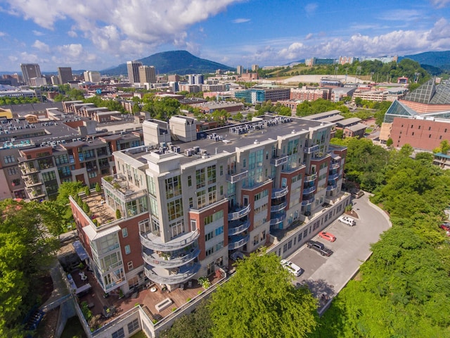 birds eye view of property featuring a mountain view and a view of city