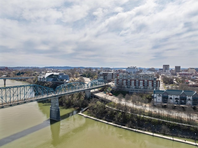 birds eye view of property featuring a water view and a view of city