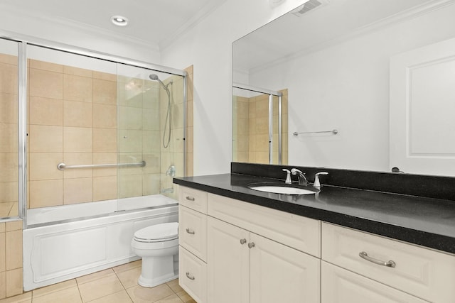 bathroom featuring visible vents, enclosed tub / shower combo, tile patterned flooring, crown molding, and toilet