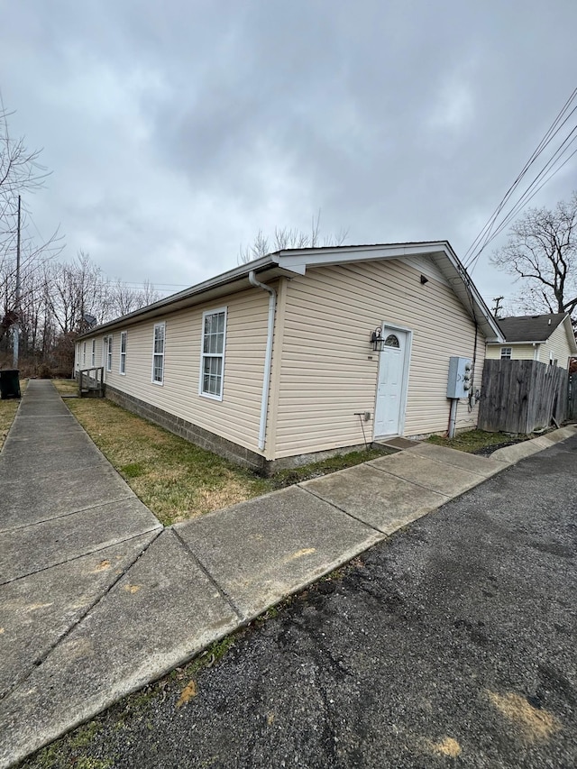 view of property exterior featuring fence