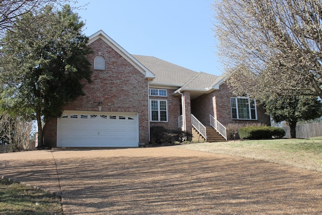 view of front of property with fence, roof with shingles, concrete driveway, a garage, and brick siding