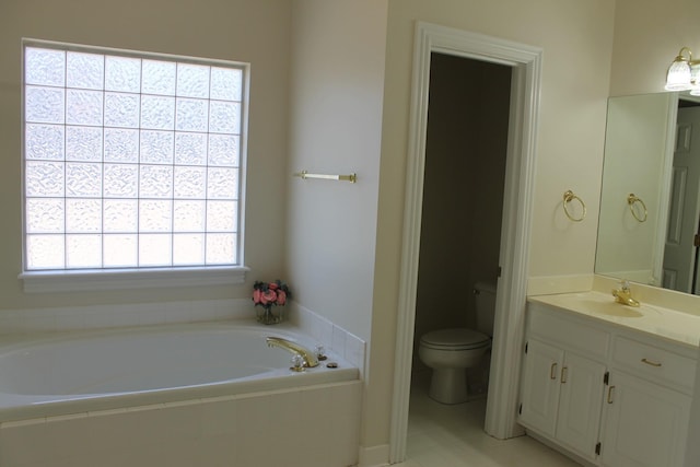 bathroom featuring a bath, toilet, and vanity