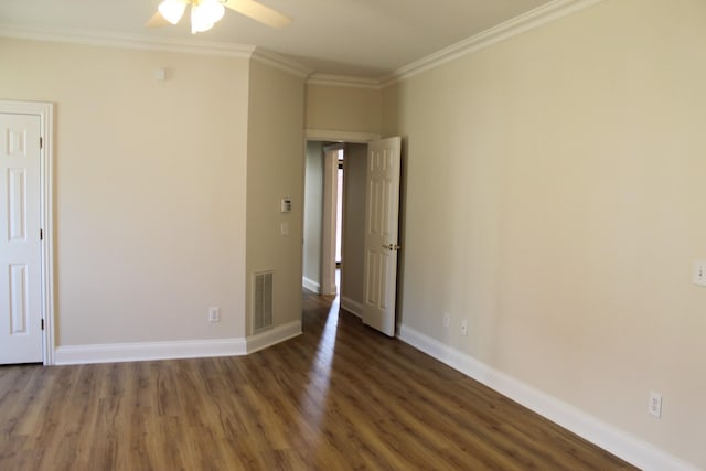 interior space featuring visible vents, wood finished floors, crown molding, baseboards, and ceiling fan