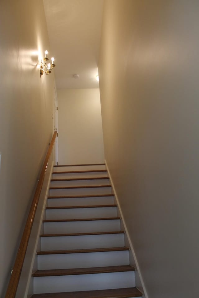 stairs featuring baseboards