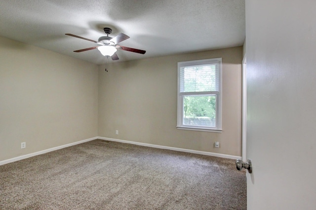 unfurnished room with ceiling fan, a textured ceiling, baseboards, and carpet floors