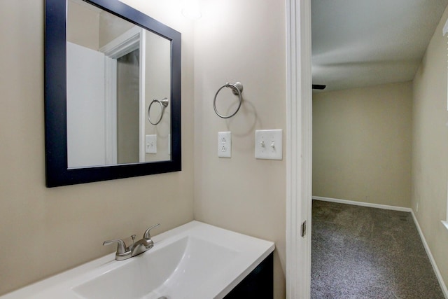 bathroom featuring vanity and baseboards