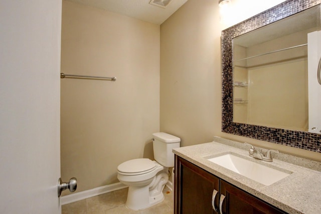 bathroom featuring tile patterned flooring, visible vents, baseboards, toilet, and vanity