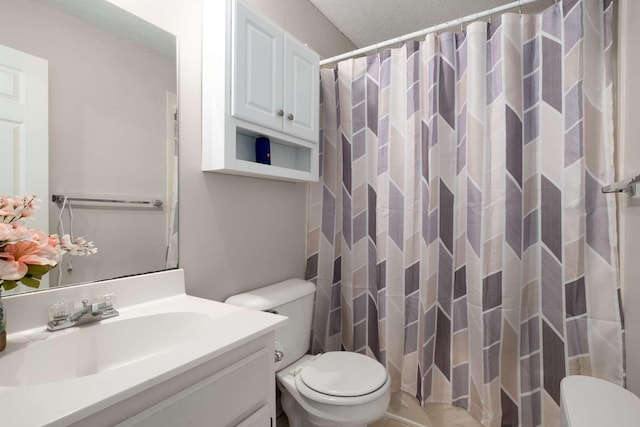 full bathroom with vanity, toilet, a shower with curtain, and a textured ceiling