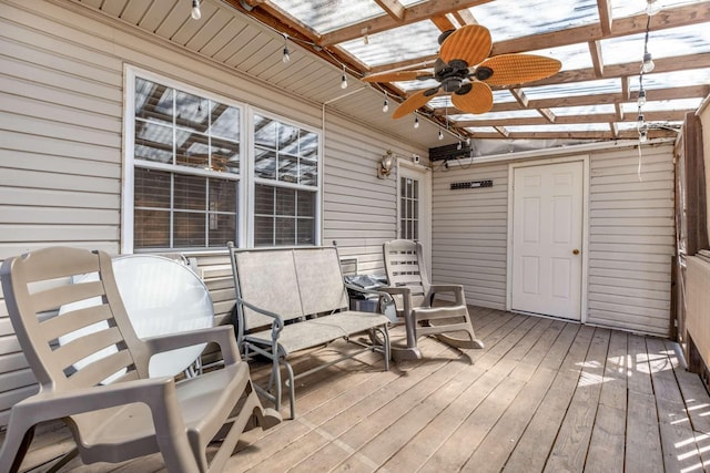 wooden deck featuring ceiling fan