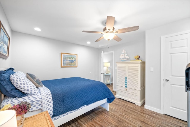 bedroom with recessed lighting, a ceiling fan, baseboards, and wood finished floors