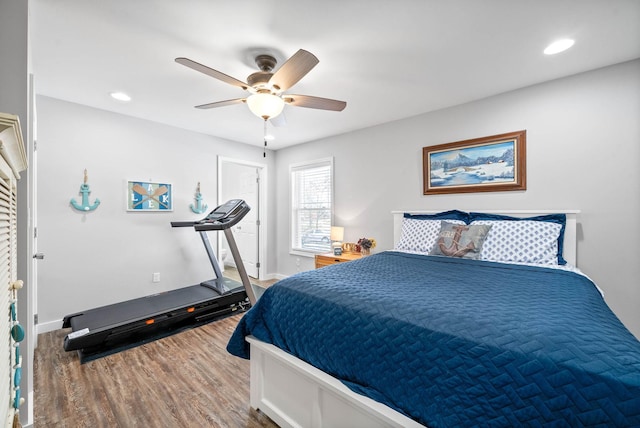 bedroom with recessed lighting, baseboards, a ceiling fan, and wood finished floors