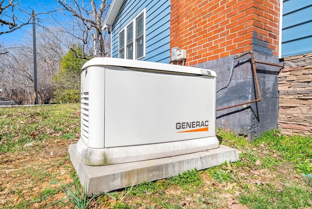 details featuring a power unit and brick siding