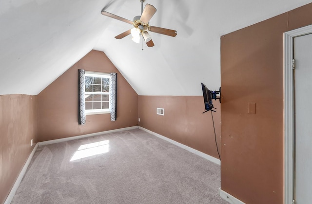 bonus room featuring lofted ceiling, baseboards, visible vents, and carpet floors