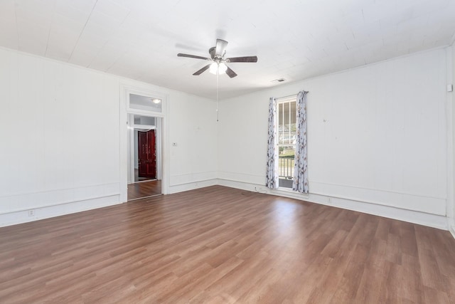 spare room featuring a ceiling fan and wood finished floors