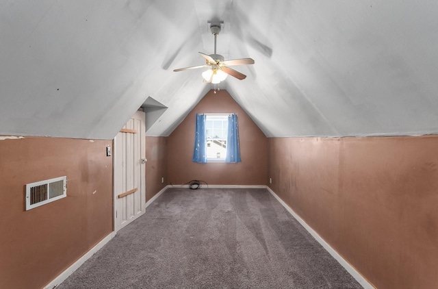 bonus room featuring carpet, visible vents, baseboards, lofted ceiling, and ceiling fan