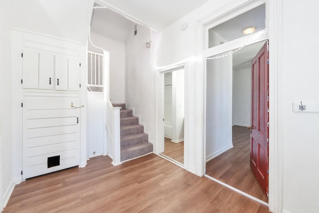 staircase with wood finished floors