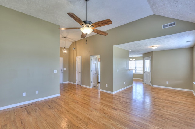 spare room featuring visible vents, baseboards, light wood-style flooring, and a ceiling fan