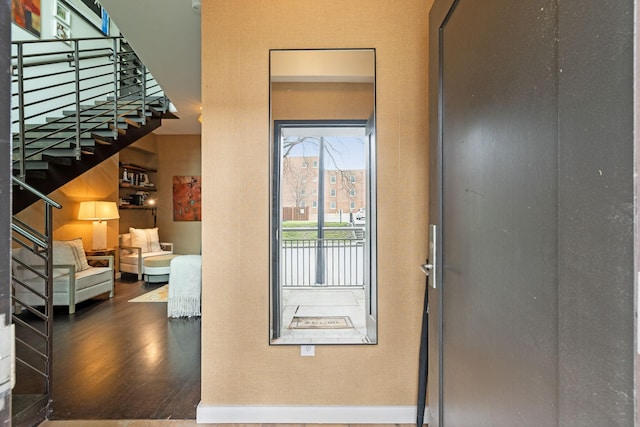 interior space featuring stairway and wood finished floors