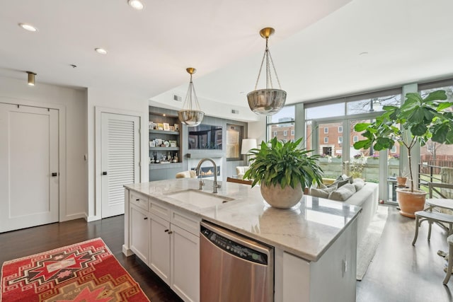 kitchen with recessed lighting, stainless steel dishwasher, dark wood-style floors, white cabinets, and a sink