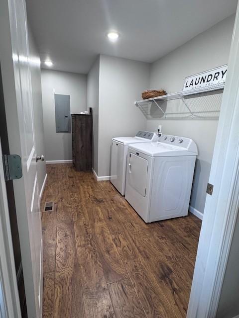 washroom with baseboards, electric panel, laundry area, dark wood-style floors, and separate washer and dryer