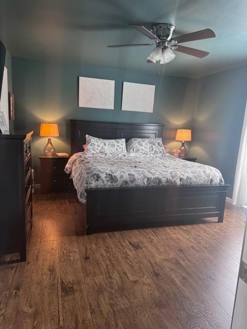 bedroom with ceiling fan and hardwood / wood-style floors