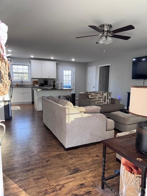 living room featuring plenty of natural light, recessed lighting, dark wood-style flooring, and ceiling fan