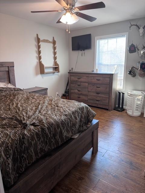 bedroom featuring ceiling fan and wood finished floors