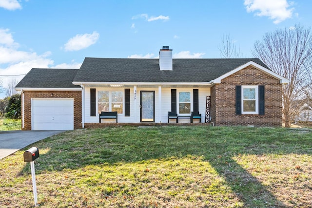 ranch-style home with brick siding, a front yard, a chimney, driveway, and an attached garage