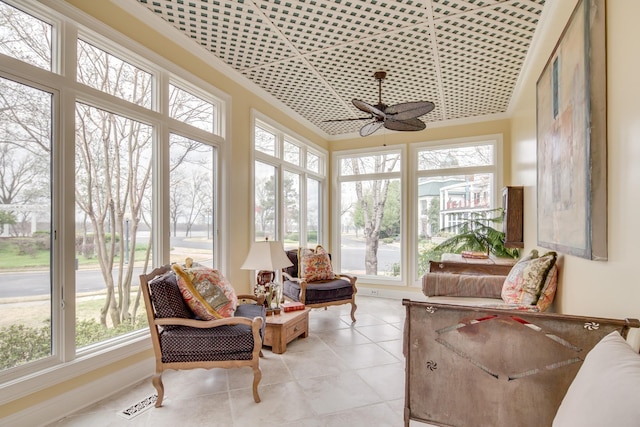 sunroom with a ceiling fan