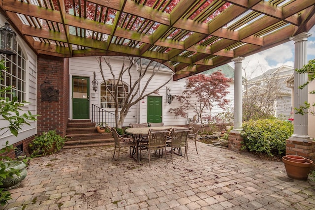 view of patio with outdoor dining area, a pergola, and entry steps