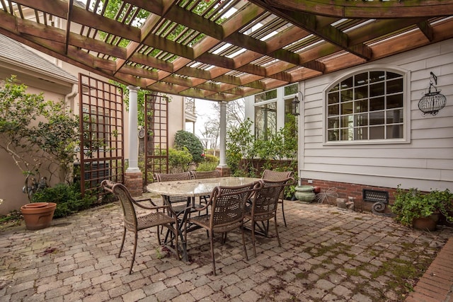 view of patio with outdoor dining area and a pergola