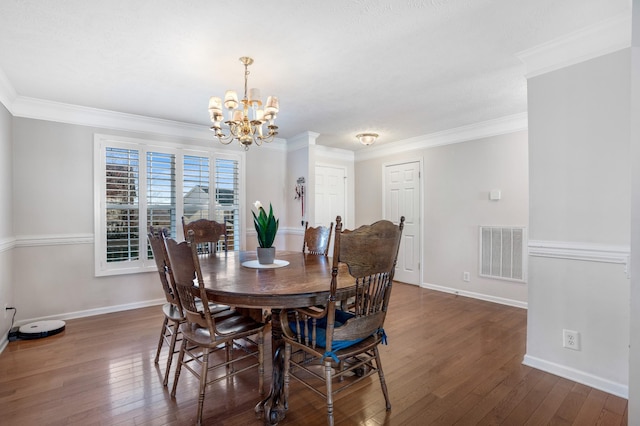 dining area featuring visible vents, baseboards, and hardwood / wood-style floors