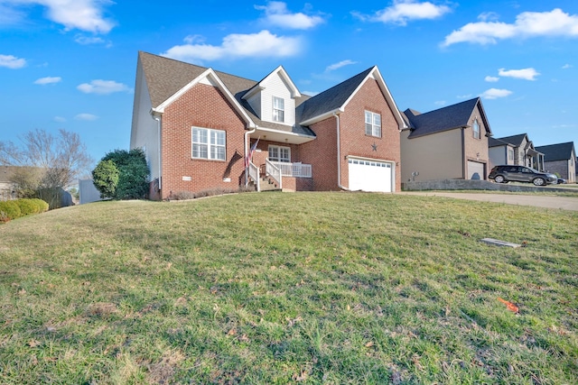 view of front of property featuring a front yard, a garage, and brick siding