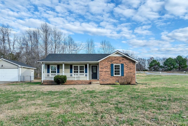 ranch-style home featuring a front yard, covered porch, a garage, crawl space, and brick siding