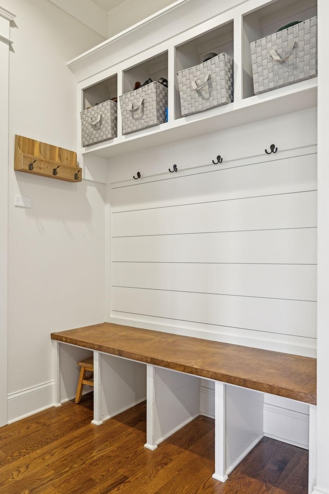 mudroom featuring baseboards and wood finished floors