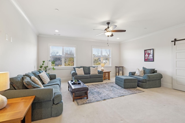 carpeted living area with baseboards, a barn door, ornamental molding, recessed lighting, and a ceiling fan