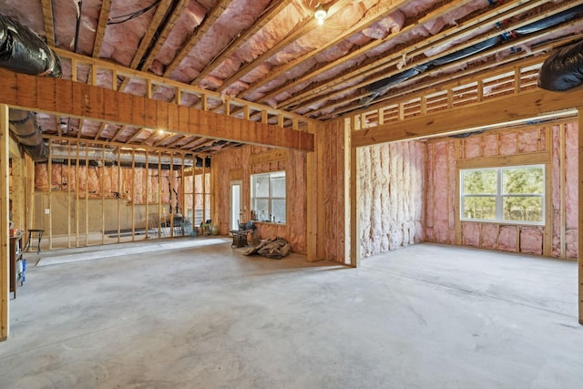 miscellaneous room featuring unfinished concrete flooring