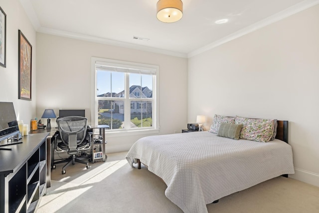 carpeted bedroom featuring visible vents, baseboards, and ornamental molding