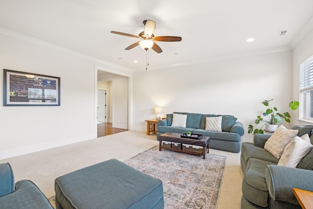 carpeted living room featuring visible vents, baseboards, ornamental molding, recessed lighting, and a ceiling fan