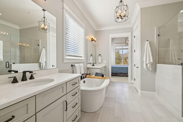 ensuite bathroom with ensuite bathroom, a chandelier, a shower stall, and crown molding