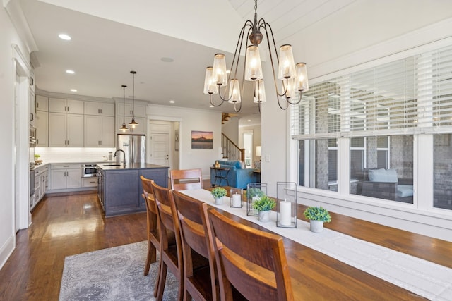 dining area featuring dark wood finished floors, stairway, recessed lighting, and ornamental molding