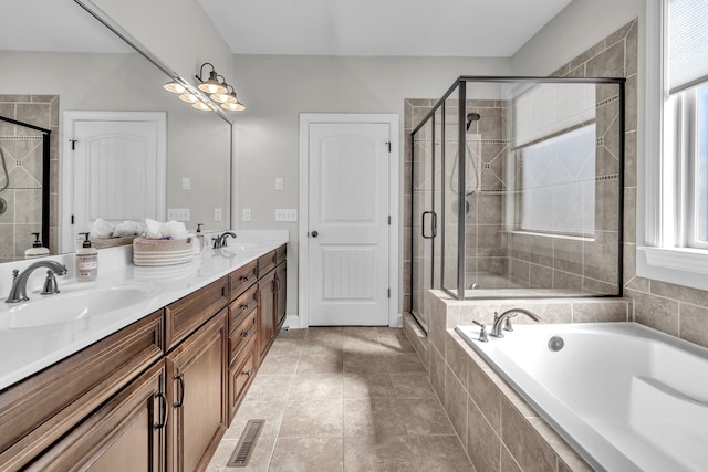 full bathroom with a shower stall, a garden tub, and a sink