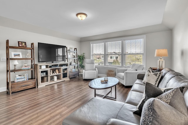 living room with wood finished floors and baseboards