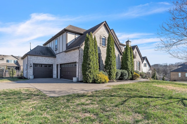 view of home's exterior with brick siding, a lawn, driveway, and a shingled roof