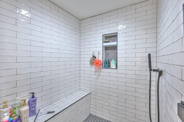 full bathroom with a tile shower