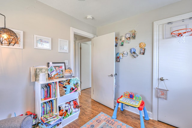 game room featuring wood finished floors