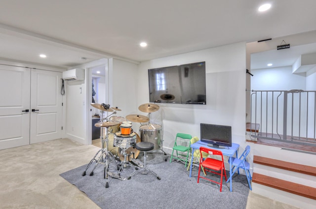 game room with recessed lighting, carpet, and an AC wall unit