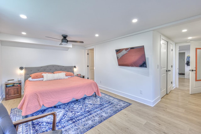 bedroom featuring recessed lighting, baseboards, light wood-style flooring, and ceiling fan