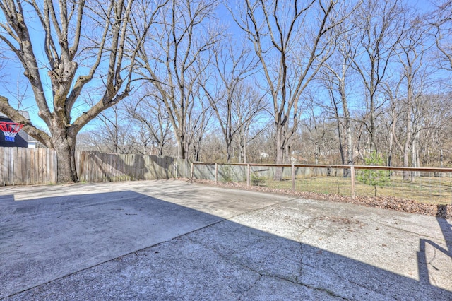 view of patio with a fenced backyard and driveway